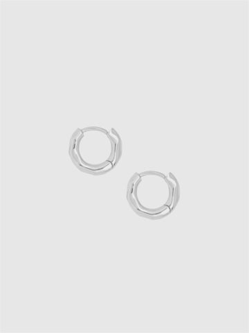 Pair of silver hoop earrings on a light gray background